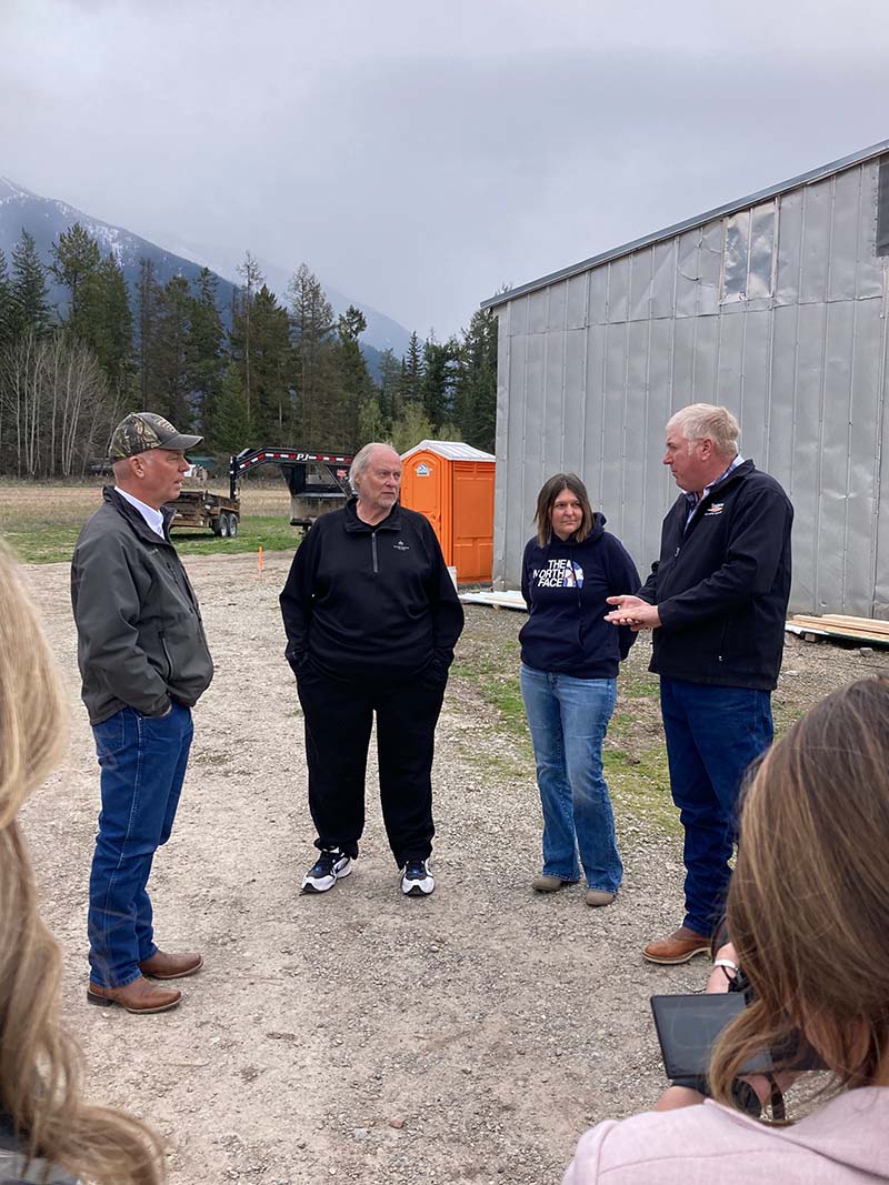 Group of people standing outdoors with a mountainous background in Montana.
